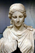 Old and slightly damaged sculpture of Artemis, a demure virgin goddess